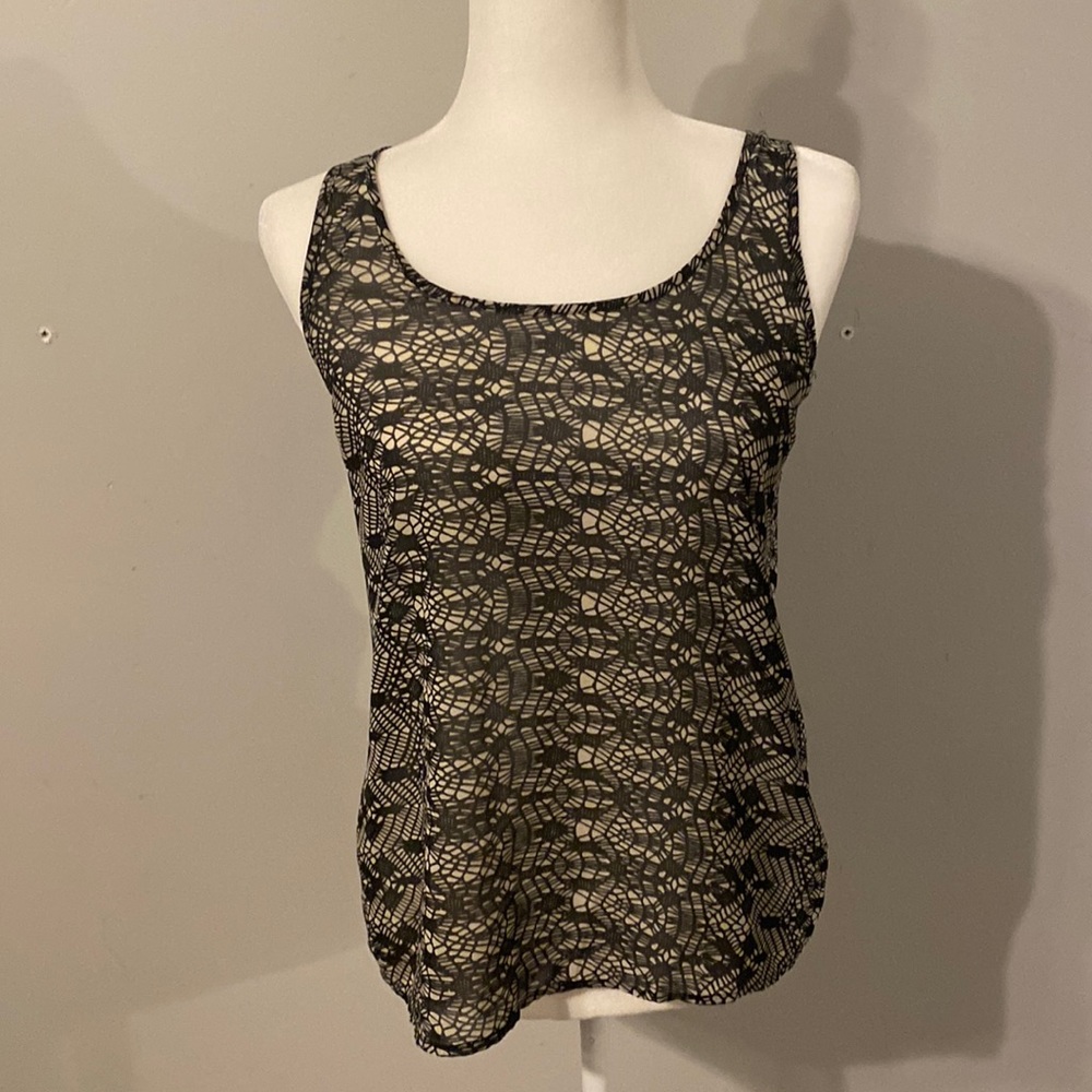 Tank top, super cute opening in the back.